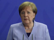 Karantinadan çıkan Angela Merkel halka seslendi, „Tarih veremem“ dedi. Şansölye Angela Merkel (Video ekran fotoğrafı)